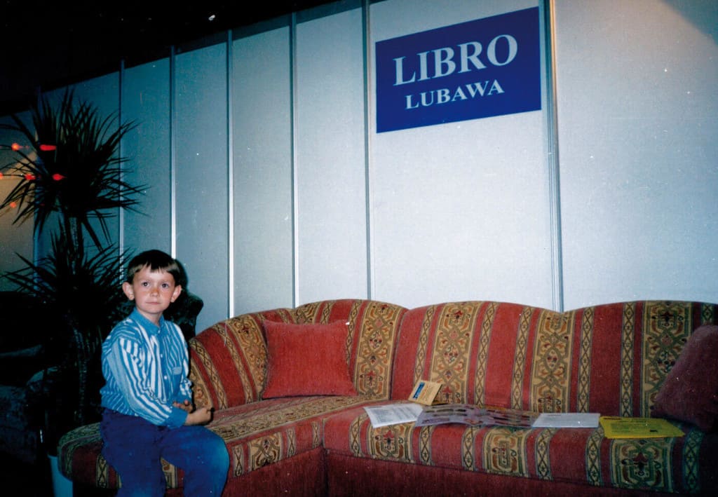 Syn, Paweł Liberacki, na ekspozycji firmowej podczas targów w Poznaniu, 1996 r.