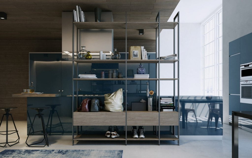 System „Orto” od Komador. Ażurowy regał w systemie „Orto” ciekawie dzieli pomieszczenie na funkcjonalne strefy oddzielając salon od kuchni, nie zabiera światła i pomaga zachować odrobinę intymności.