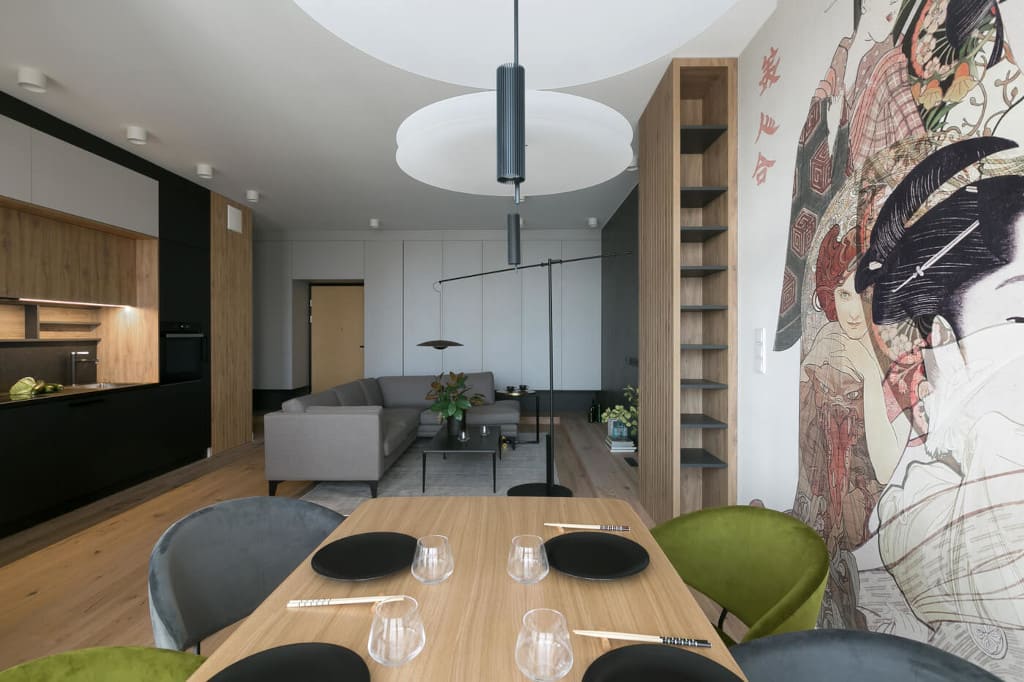 Część dzienna z typowym podziałem na strefy – kuchenną, jadalnianą i wypoczynkową. Projekt - architekci z Mikołajska Studio.