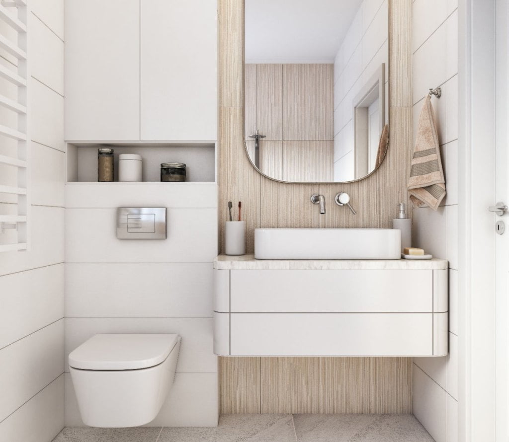 Meble łazienkowe w jasnej, białej łazience.