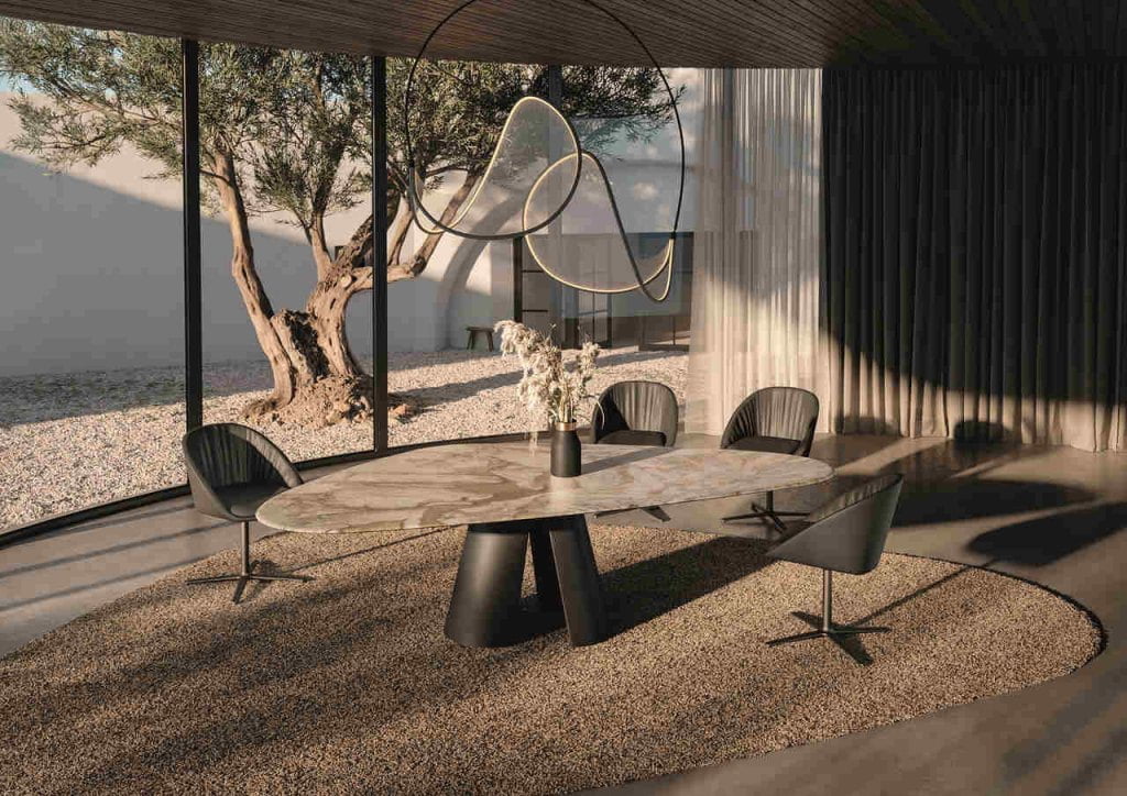 Co eksportować do Niemiec? Jakie meble? Asymetryczny blat kamiennego stołu do jadalni pozwala na ciekawą aranżację miejsc siedzących i tym samym otwiera przed gośćmi nowe perspektywy.