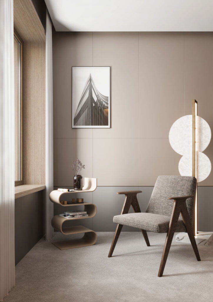 Salon w ciepłej szaro-beżowej kolorystyce, fotel na pierwszym planie. Meble wyprodukowana z użyciem płyt RAUVISIO crystal z oferty REHAU