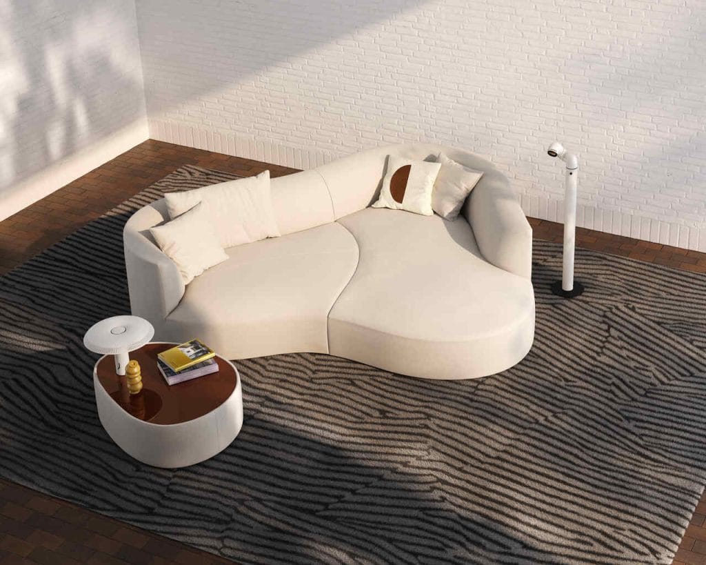 Łagodnie wygięta linia sofy sięgającej podłogi zachęca do relaksu. Fot. Cor.