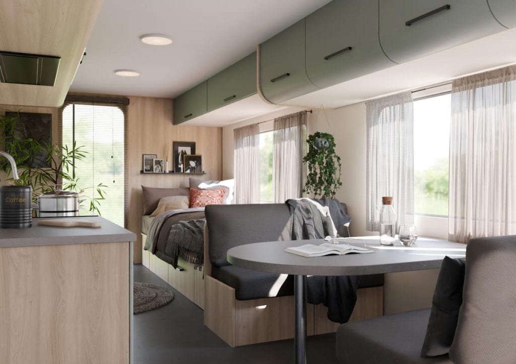 owoczesne wnętrze kampera z dekorami Helia z kolekcji CARAVAN Interprint – jasne drewno i zielone szafki