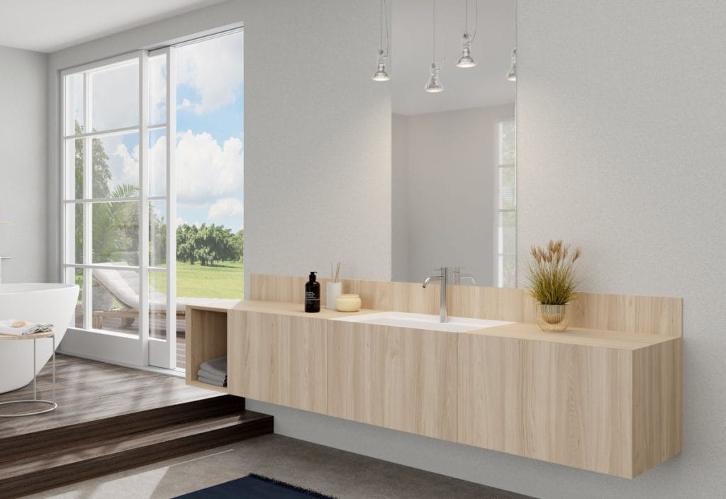 Podwieszana szafka łazienkowa zintegrowana z umywalką, wykończona jasnym, naturalnym dekorem drewna Interprint Helia. Minimalistyczny design łazienki z widokiem na taras, utrzymany w jasnej, skandynawskiej kolorystyce.