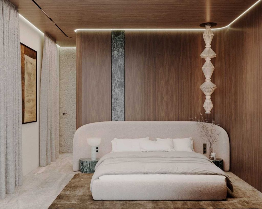 Sypialnia Master: Prywatna oaza spokoju z wyrazistym akcentem zielonego marmuru, który wprowadza kolorystykę jeziora do strefy nocnej.