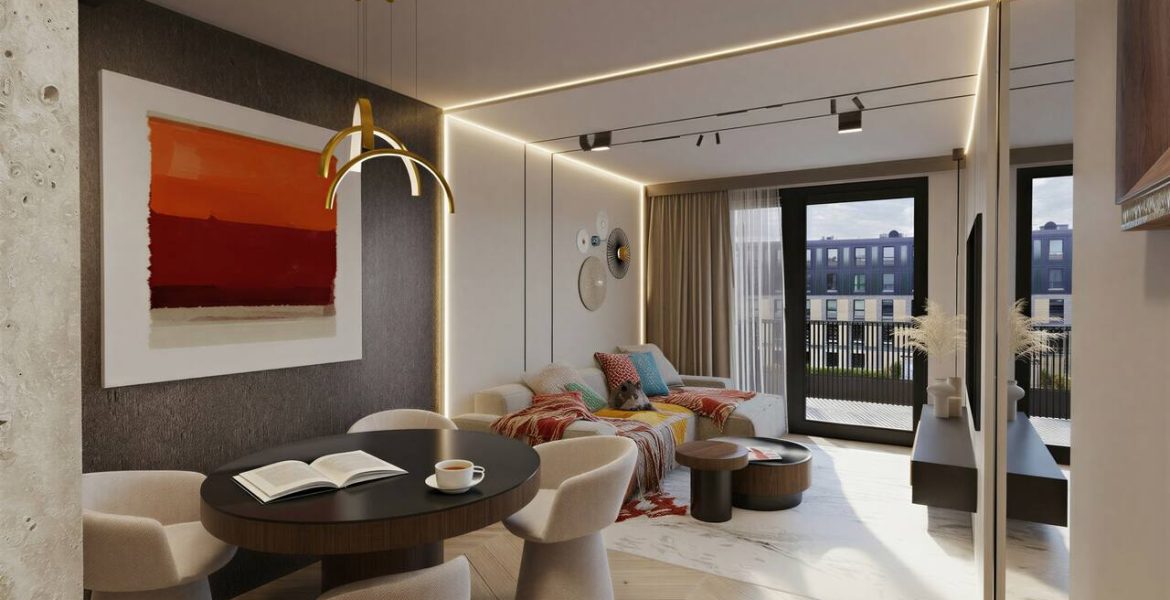 Apartament o pow. ok. 55 m2 w inwestycji Młyny Mogilska w Krakowie. Większość ścian przeznaczonego pod wynajem dla klienta premium lokalu wykończono z wykorzystaniem spieków wielkoformatowych i płyt meblowych pokrytych orzechowym fornirem lub lakierowanych w odcieniach jasnego beżu. Szlachetne faktury o stonowanych, choć kontrastujących barwach, dopełniono akcentami w intensywniejszych kolorach. Projekt i realizacja: Swałtek Design Studio.
